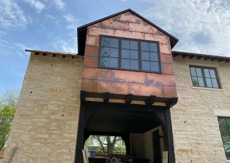 Copper metal panel facade on a stone building for Metal Roof Coating in Alamogordo